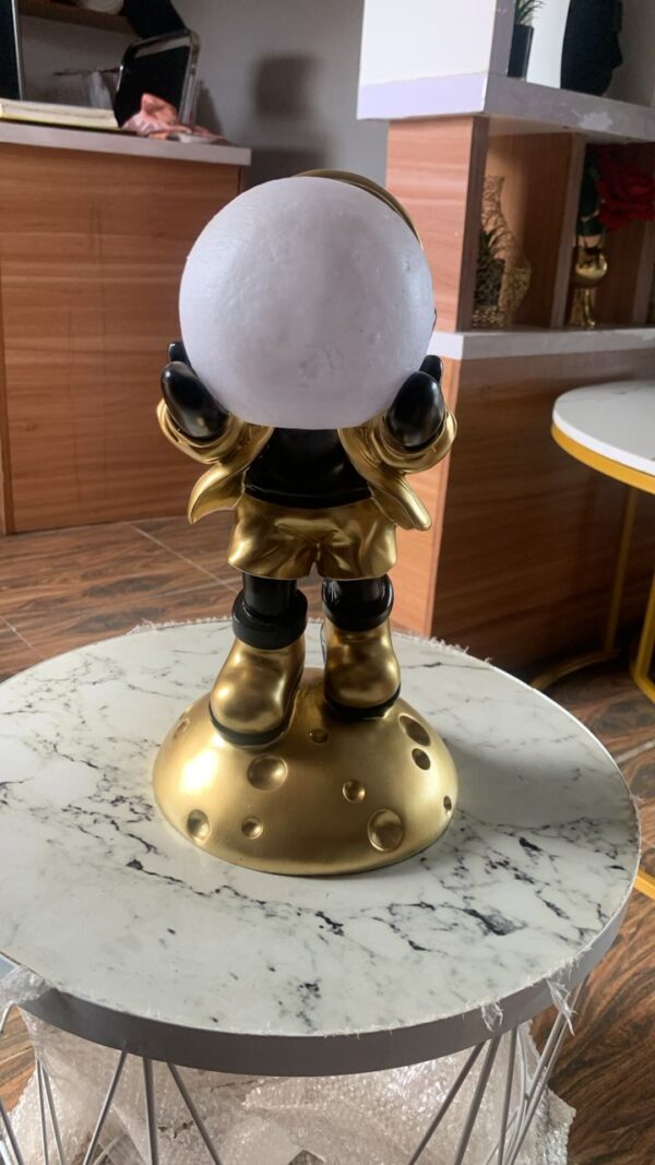 Gold German astronaut with moonlight
